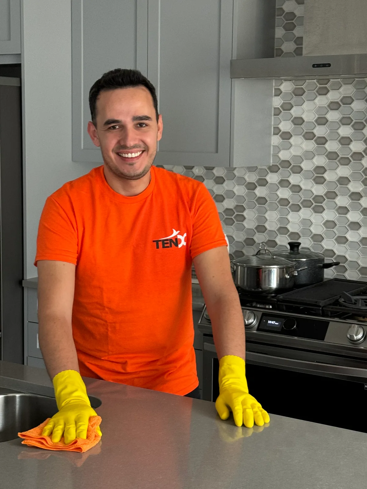 Man cleaning kitchen island