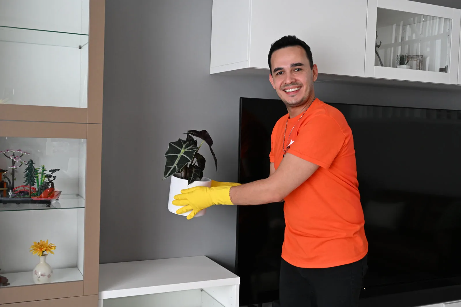 Man holding plant vase