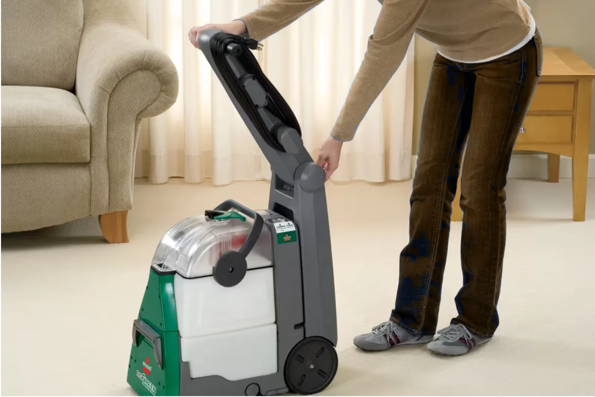 Person cleaning a house carpet