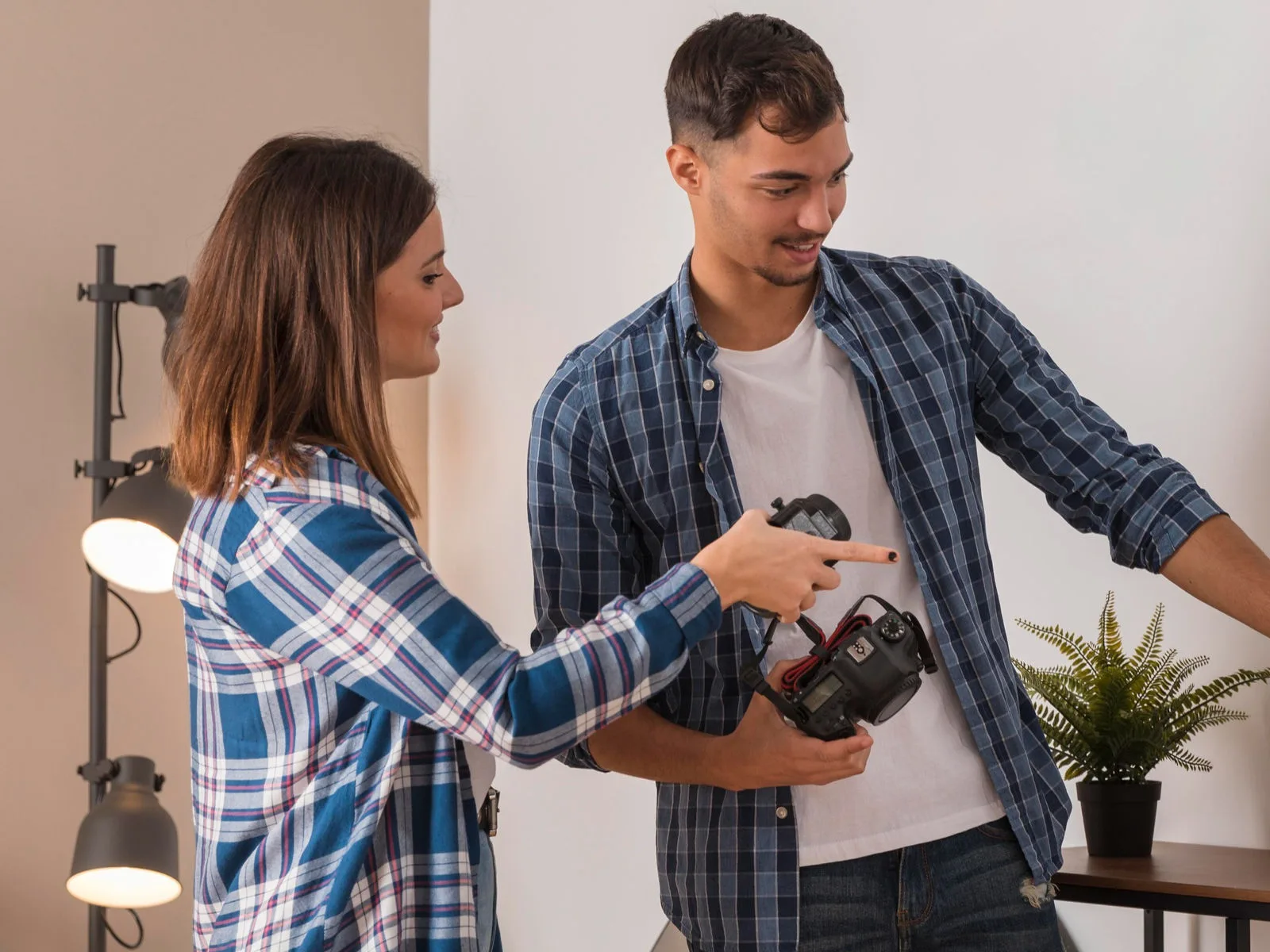 Man and woman preparing for a photoshoot